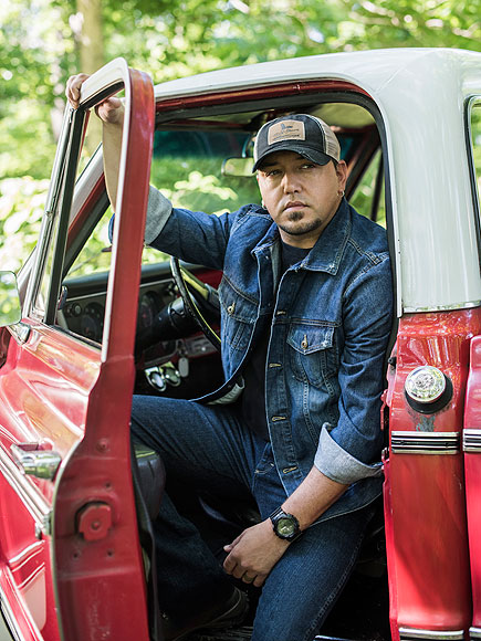 Jason Aldean pictured with the car
