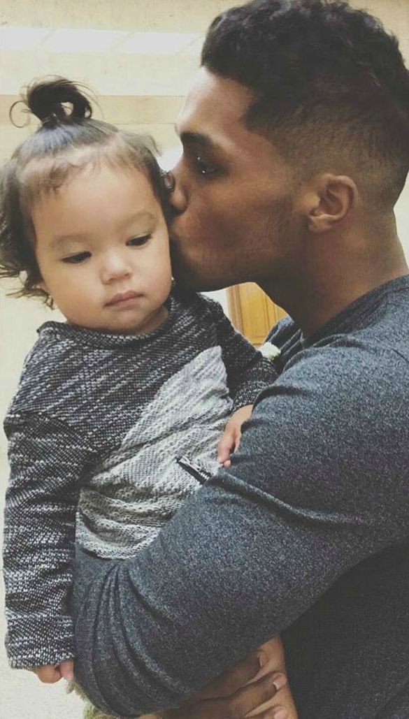 Boy Flynn's father Roman kisses his daughter