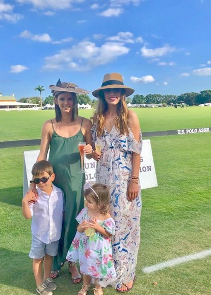 Renee Satterthwaite clicks for photo with sister and kids