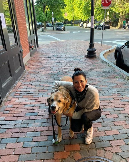 Renee Satterthwaite clicks for photo with dog