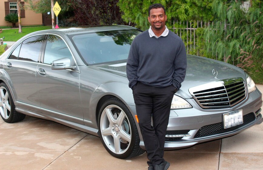 Robin Stapleler's ex-husband Alfonso poses for a photo with his car 