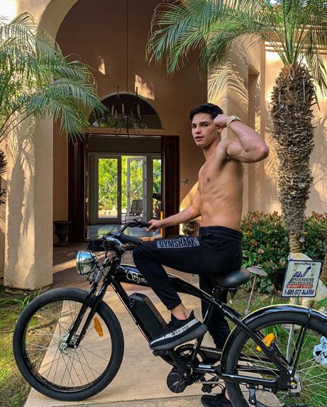 Ryan Garcia showing his body on a bike