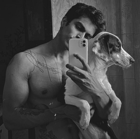Treven Dias and his pet dog