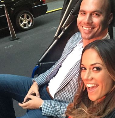 Mike Caussin taps his wife for a selfie