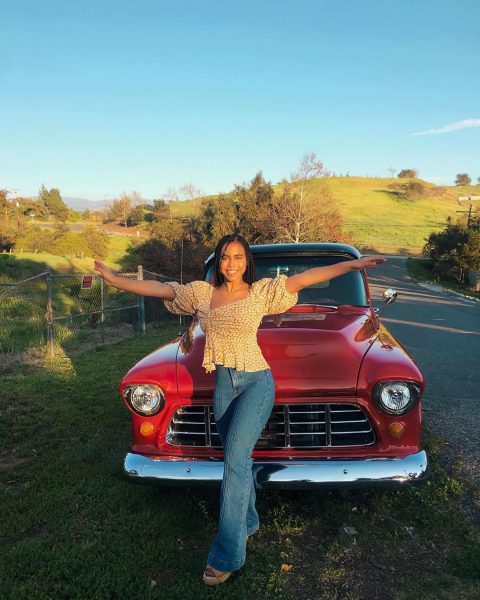 Asia Lei poses with her car