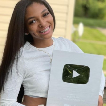 Bennet Tyson shows off her silver play button