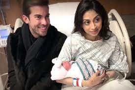 Luis D. Ortiz with his wife and daughter