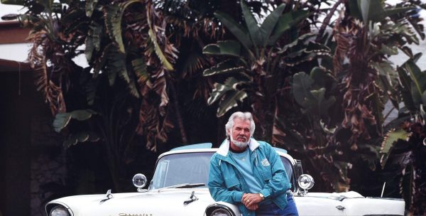 Marianne Gordon's late husband Kenny Rogers with his 1957 convertible Cadillac on January 15, 1990 in Beverly Hills, Los Angeles, California