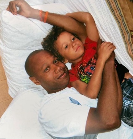 Childhood photo of Armani Jackson with his father 