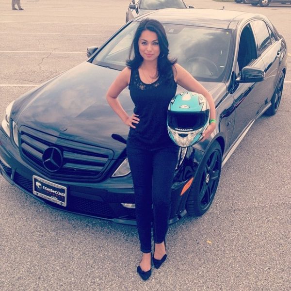 Aishah Hasnie poses for a photo with her car 