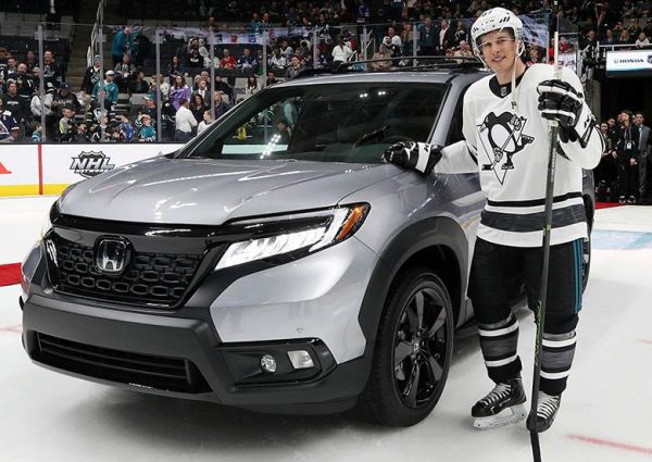 Sidney Crosby in front of his car