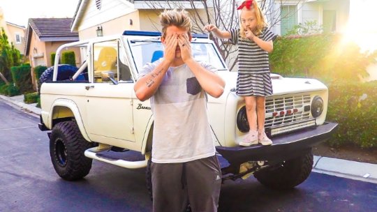 Cole LaBrant with his daughter and their car