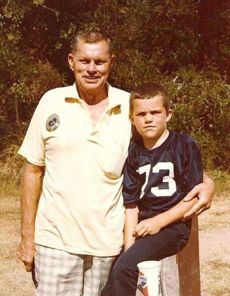 Chuck Liddell stands with his grandfather in his childhood photo