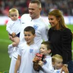 Wayne Rooney with his wife and children