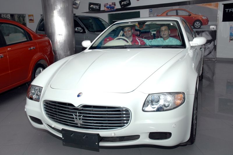 Vijay Arora and his son Farhad in a Maserati