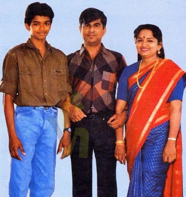 A photo of Vijay with his parents as a child