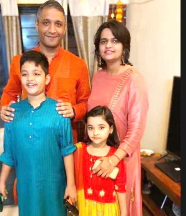 Team leader Valen Singh with his wife and children