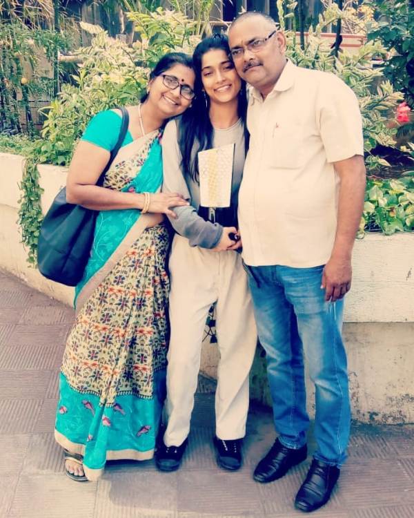 Vartika Jha and her parents