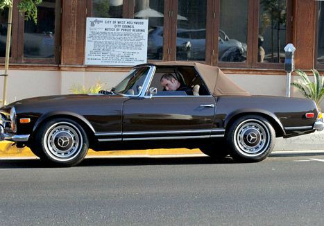 John Travolta drives his classic car