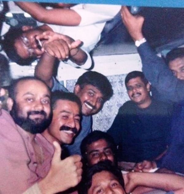 Old photo of Sumit Awasthi with other journalists