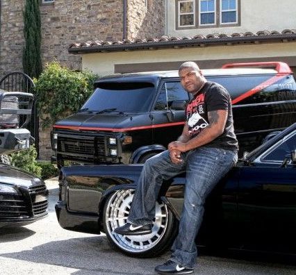 Rampage Jackson poses with his car