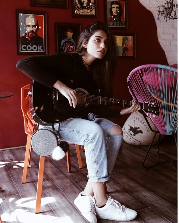 Sobhita Dhulipala playing guitar