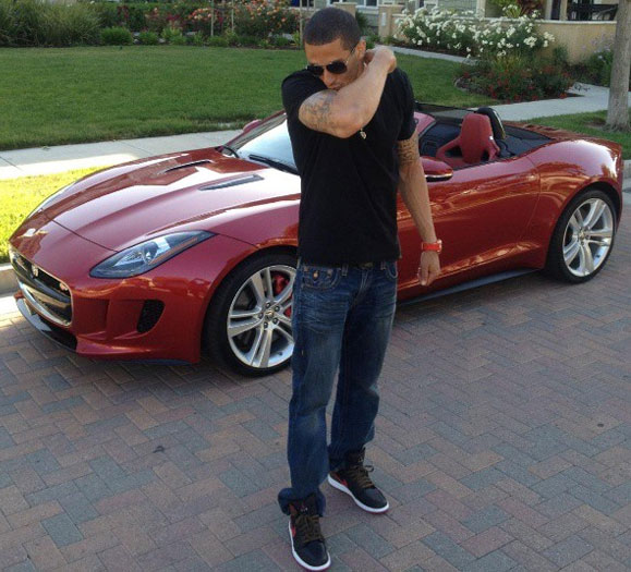 Colin Kaepernick poses with his car