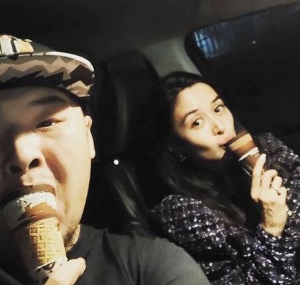 Perry Choi and his wife Kris Bernal posing in the car
