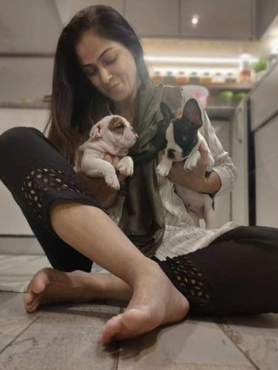 Simran poses with the dog