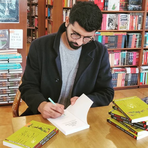 Shwetabh signs his book as it launches in the bookstore