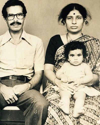 A photo of Shubha Poonja with his parents as a child
