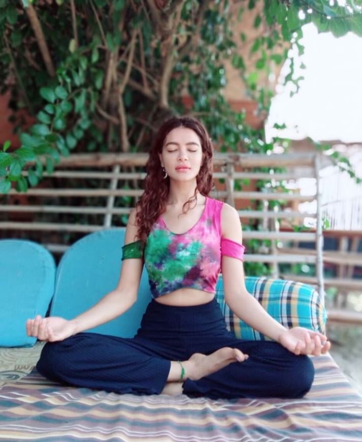 Shristi doing yoga at home