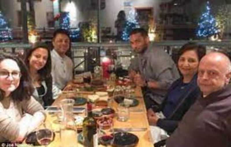 Shrien Dewani's sister (second from left), Shrien Dewani (third from left), his boyfriend (fourth) and his parents (a pair sitting together)