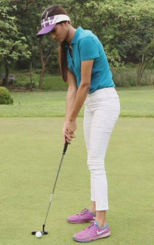 Shreya golfing