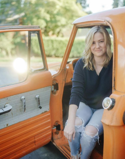 Jaymee Sire poses with her car