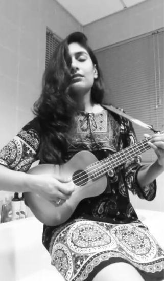 Kira Narayanan playing ukulele