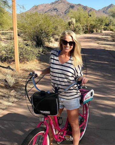Kelly Krell poses with her bike