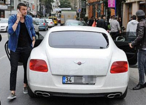 Blake Yilmaz standing outside the car