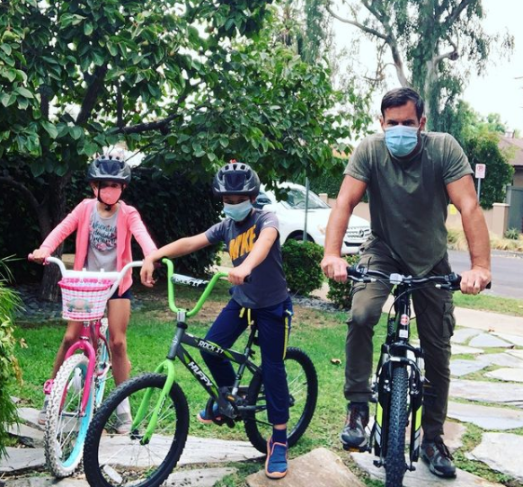 Tuc Watkins and his twins go on a bike ride