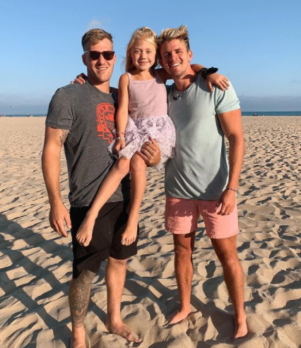 Everleigh Soutas with her father and stepfather 